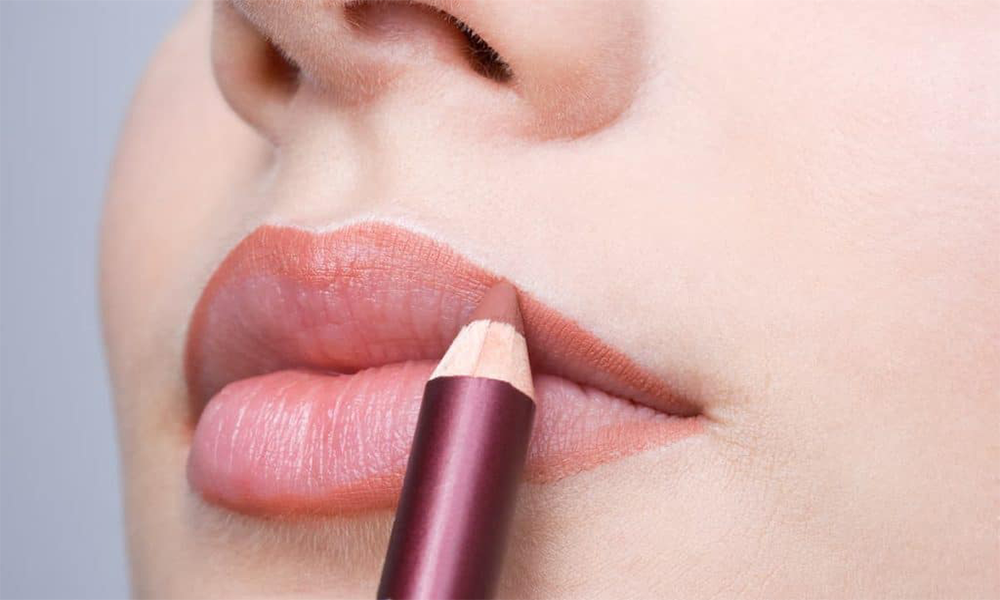 A modern makeup look featuring dark lip liner paired with nude lipstick.